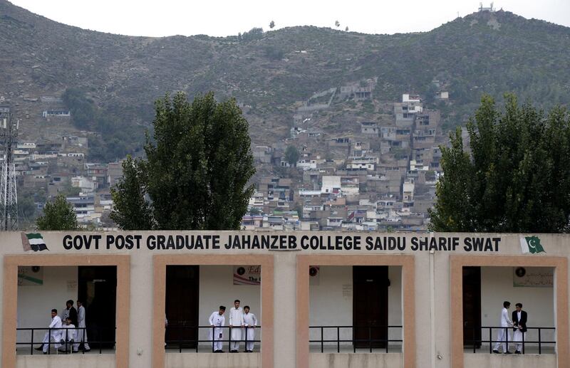 Students enjoy talking to each other in their hostel at a rebuilt government college in Saidu Sharif city of Pakistan‚Äôs Khyber Pakhtunkhwa province. Aamir Saeed for The National 