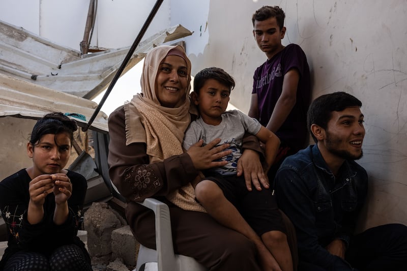 Taghrid Nassir, 37, sits with her children. She says she is plagued by nightmares since the bombing of her neighbourhood.