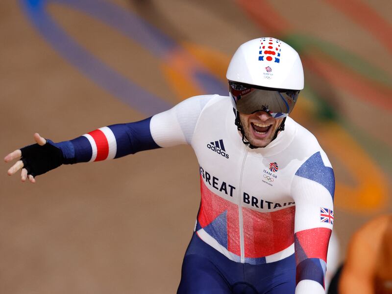 Jason Kenny celebrates taking gold in the men's track cycling keirin final at the Tokyo Olympics.