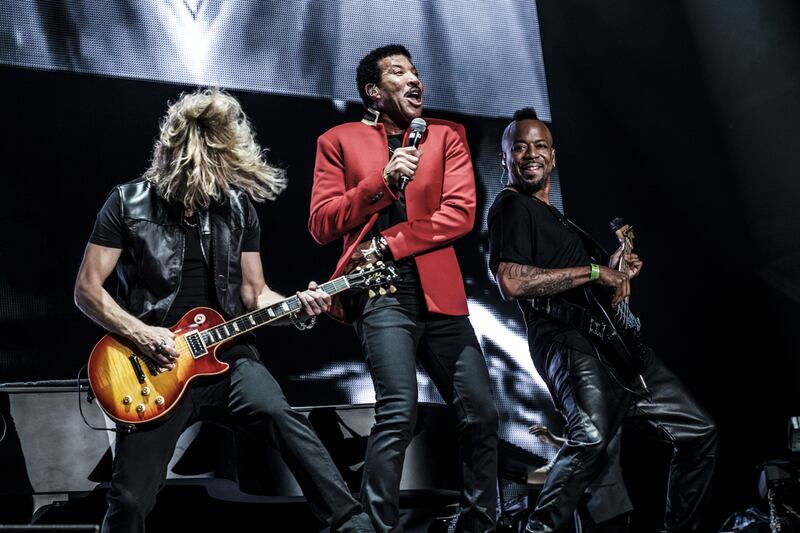 Lionel Richie performs at the du Arena on Yas Island in Abu Dhabi. Below, the crowd waits in anticipation of their favorite artists at Beats on the Beach. Waleed Shah for The National