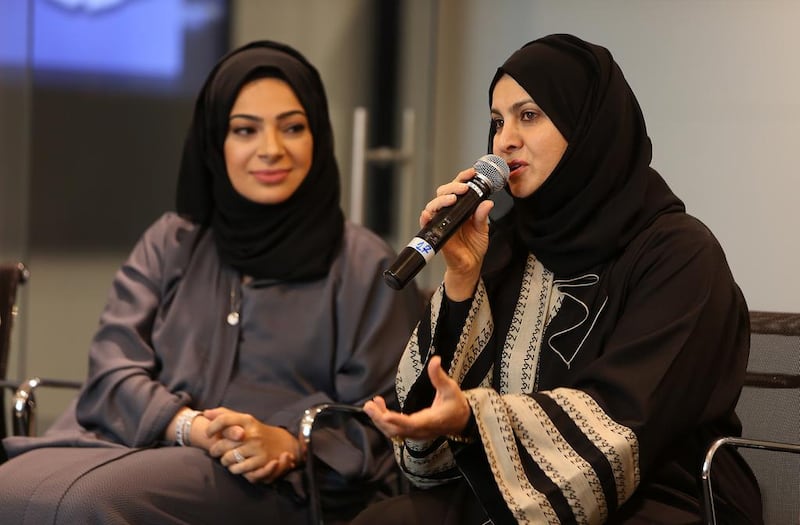 Lubna Qassim, left, executive vice president, company secretary and general counsel for Emirates NBD, listens to Habiba Al Marashi, chairwoman of the Emirates Environmental Group. Pawan Singh / The National