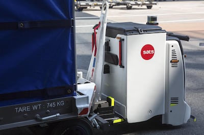 An Autonomous Container Trailer transports a cargo container to the baggage holding area during a test drive at Changi International Airport in Singapore, on Tuesday, July 17, 2018. The airport, voted the world's best for the past six years by Skytrax, is pursuing that goal of extensive automation with such vigor that it built an entire terminal to help test the airport bots of the future. Photographer: Ore Huiying/Bloomberg