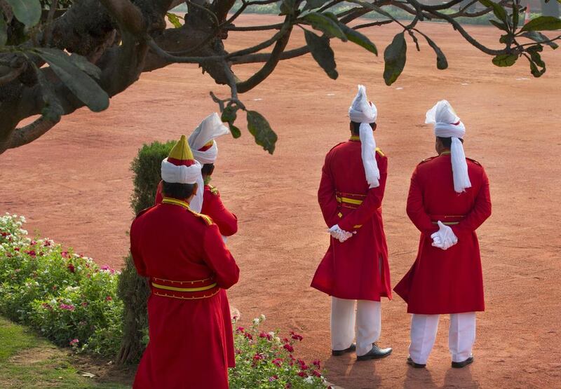 Indian presidential staff watch as Sheikh Mohammed bin Zayed, Abu Dhabi Crown Prince and Deputy Supreme Commander of the Armed Forces arrives at the Indian presidential palace. Manish Swarup / AP Photo