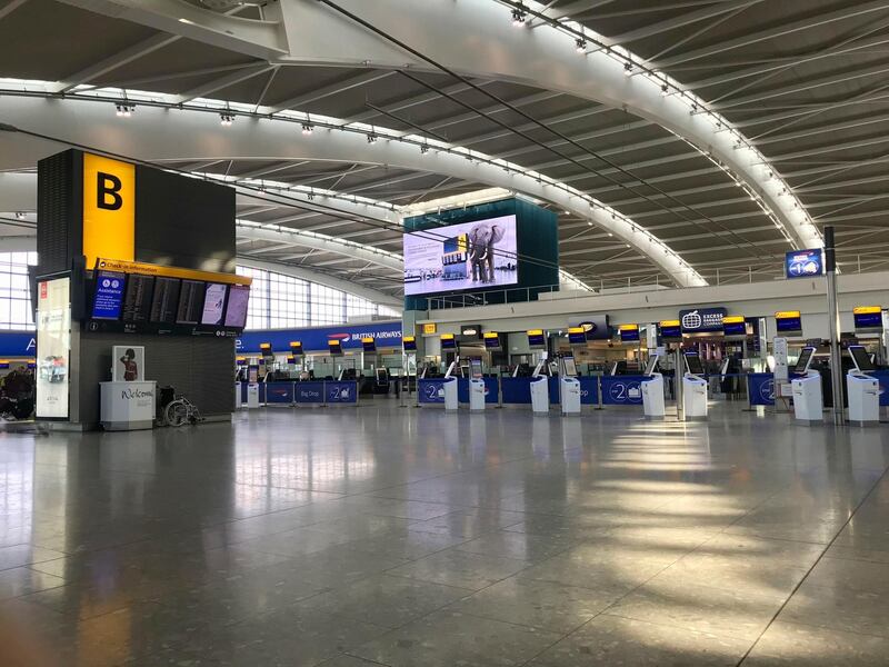 A view of the near empty departure area at London's Heathrow Airport's Terminal 5 departure, Thursday March 12, 2020. As a virus pandemic spreads globally, China and other parts of Asia are scrambling to prevent it from coming back to where it broke out. Everyone arriving in Beijing must quarantine for 14 days, and South Korea is screening arriving passengers from more countries as the number of cases rises across Europe. For most people, the new coronavirus causes only mild or moderate symptoms, such as fever and cough. For some, especially older adults and people with existing health problems, it can cause more severe illness, including pneumonia.  (Steve Parsons/PA via AP)