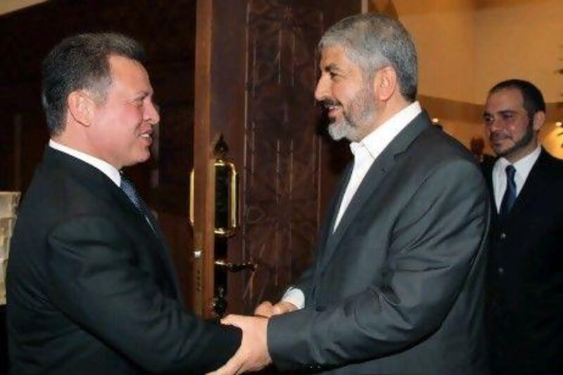 King Abdullah II of Jordan (left) welcomes senior Hamas leader Khaled Meshaal upon his arrival to the Royal Palace in Amman last month. Hamas is seen as a key player in the relationship between the Jordanian monarchy and the Muslim Brotherhood, which has become increasingly strained.