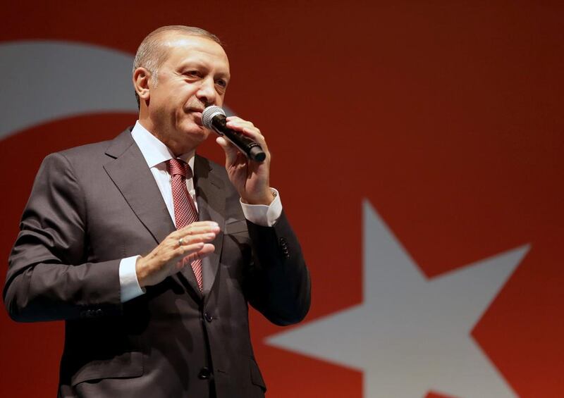 Turkish President Tayyip Erdogan addresses his supporters outside his residence in Istanbul, Turkey, early July 19, 2016.  Murat Cetinmuhurdar/Presidential Palace/ Reuters 