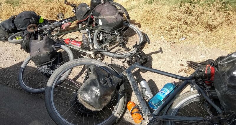 In this photo taken on Sunday, July 29, 2018, cycles are left where four tourists were killed when a car rammed into a group of foreigners on bicycles south of the capital of Dushanbe, Tajikistan. The Islamic State group on Tuesday claimed responsibility for a car-and-knife attack on Western tourists cycling in Tajikistan that killed two Americans and two Europeans. (AP Photo/Zuly Rahmatova)