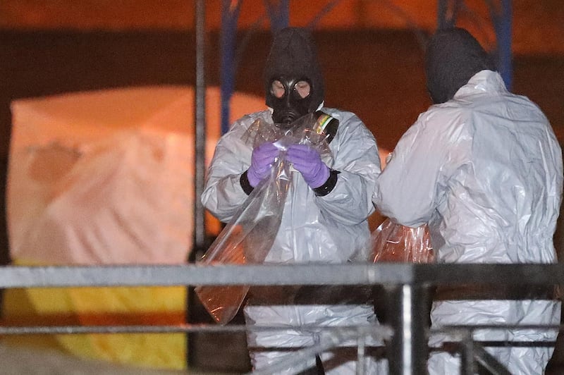 SALISBURY, ENGLAND - MARCH 13:  Police officers in forensics suits and protective masks work at the scene of the poisoning of Sergei Skripal on March 13, 2018 in Salisbury, England. British Prime Minister Theresa May has given the Russian government a deadline of midnight tonight to explain why a nerve agent of Russian origin was used in the poisoning of former Russian agent Sergei Skripal and his daughter. Mr Skripal who was granted refuge in the UK following a 'spy swap' between the US and Russia in 2010 and his daughter remain critically ill after being attacked with a nerve agent.  (Photo by Christopher Furlong/Getty Images)