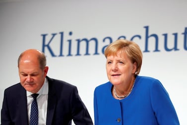 German Chancellor Angela Merkel and Finance Minister Olaf Scholz attend a news conference on climate policy in Berlin after a meeting on September 20, 2019. Reuters
