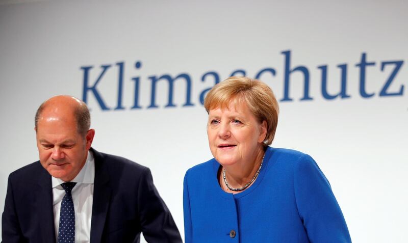 German Chancellor Angela Merkel and Finance Minister Olaf Scholz attend a news conference at the Futurium in Berlin, Germany, September 20, 2019. REUTERS/Hannibal Hanschke