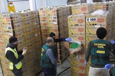 Spanish police find large quantities of cocaine hidden in boxes of bananas.