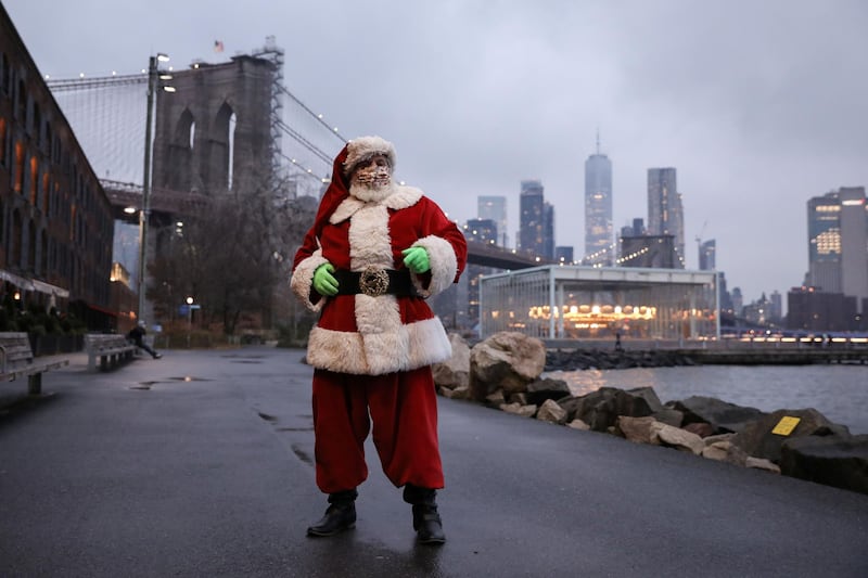 Dana Friedman, 61, poses for a portrait in Brooklyn, New York, US, December 9. Mr Friedman is an attorney by trade and started appearing as Santa Claus in 2001 for first responders and their families after 9/11 and has continued the tradition. Reuters