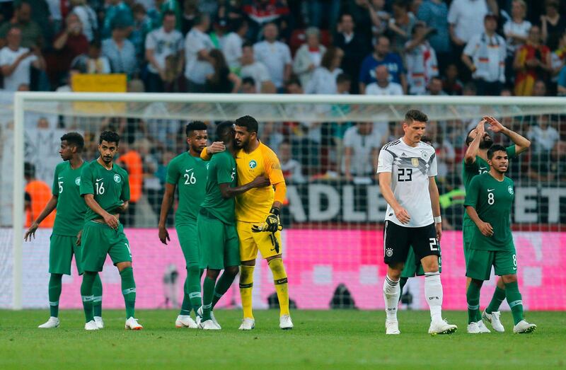 Germany's midfielder Mario Gomez (3rd R) and players of Saudi Arabia react after the international friendly football match between Germany and Saudi Arabia at the BayArena stadium in Leverkusen, western Germany, on June 8, 2018. / AFP / LEON KUEGELER
