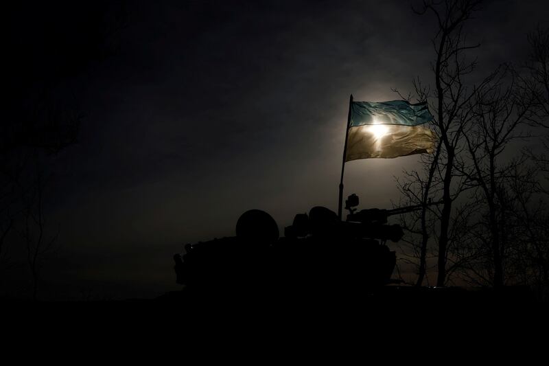 A Ukrainian flag attached to a tank flutters in the wind in Bakhmut. Reuters