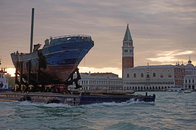 epa07551783 The arrival of the Icelandic Christoph Bucher artwork 'Barca Nostra', the fishing boat with 700 migrants on board which sank in the Mediterranean Sea in 2015, in Venice, northern Italy, 06 May 2019. The boat will become an artistic installation within the 58th Biennale of Art that runs from 11 may to 24 November.  EPA/ANDREA MEROLA