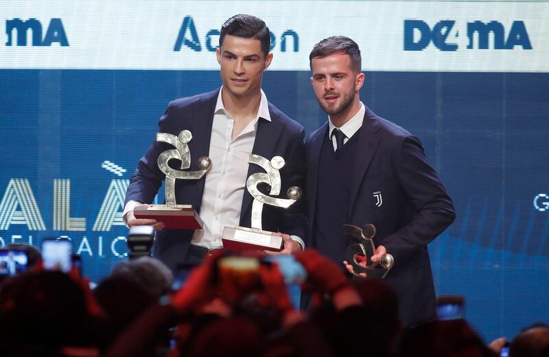 Cristiano Ronaldo, left, and Juventus teammate Miralem Pjanic together after being named in the Gran Gala del Calcio 2019 Best XI. AP Photo