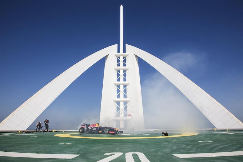 David Coulthard of Scotland performs in a Red Bull Racing Formula One car on the helipad of the Burj Al Arab hotel in Dubai. Samo Vidic/Red Bull Content Pool 