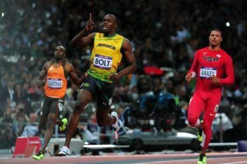 Usain Bolt of Jamaica celebrates winning gold in the men's 100-metre final on Day 9 of the London 2012 Olympic Games.