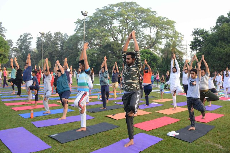 Indian yoga practitioners take part in a yoga session ahead of International Yoga Day at a park in Amritsar. Narinder Nanu / AFP Photo