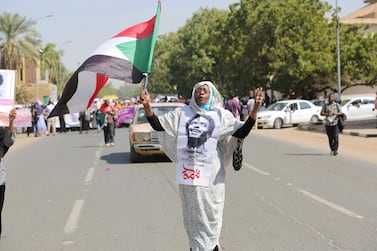 A Sudanese woman participates in a demonstration to demand Sudan join the international community in ending discriminatory laws against women, in Khartoum. EPA
