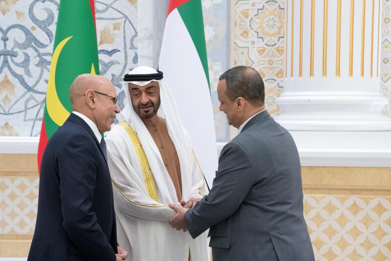 ABU DHABI, UNITED ARAB EMIRATES - February 02, 2020: HH Sheikh Mohamed bin Zayed Al Nahyan, Crown Prince of Abu Dhabi and Deputy Supreme Commander of the UAE Armed Forces (C) greets a member of the Mauritanian delegation accompanying HE Mohamed Ould Ghazouani, President of Mauritania (L), during an official visit reception, at Qasr Al Watan. 

( Hamad Al Kaabi / Ministry of Presidential Affairs )​
---