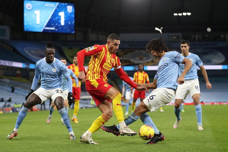 MANCHESTER, ENGLAND - DECEMBER 15: Jake Livermore of West Bromwich Albion battle for possession with Nathan Ake of Manchester City during the Premier League match between Manchester City and West Bromwich Albion at Etihad Stadium on December 15, 2020 in Manchester, England. The match will be played without fans, behind closed doors as a Covid-19 precaution.  (Photo by Martin Rickett - Pool/Getty Images)