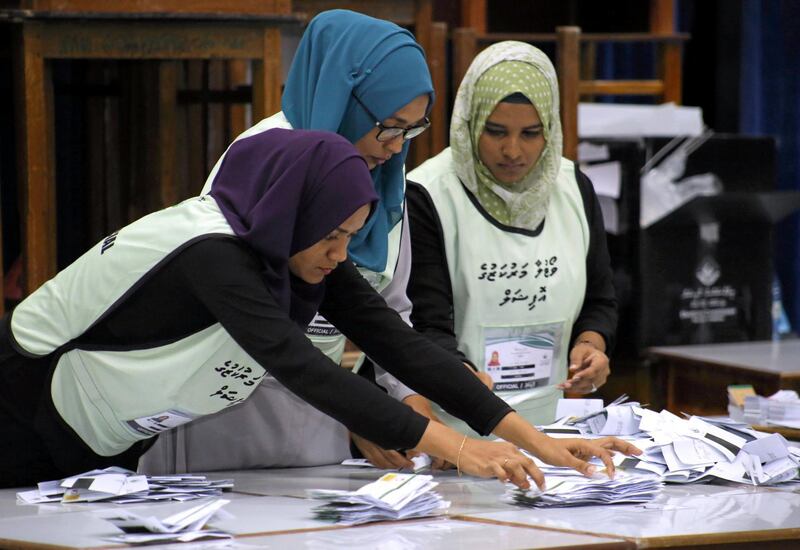 Maldives election commission officials prepare ballot papers for counting votes at a polling station at the end of the presidential election day in Male, Maldives September 23, 2018. REUTERS/Ashwa Faheem