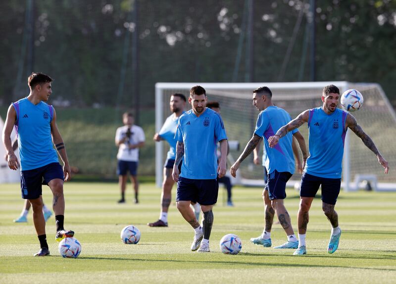 Lionel Messi with teammates Rodrigo de Paul (r) and Paulo Dybala. EPA