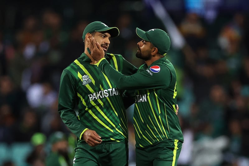 Pakistan captain Babar Azam talks to Haris Rauf at the Sydney Cricket Ground. Getty