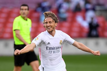 BARCELONA, SPAIN - OCTOBER 24: Luka Modric of Real Madrid celebrates after scoring his team's third goal during the La Liga Santander match between FC Barcelona and Real Madrid at Camp Nou on October 24, 2020 in Barcelona, Spain. Sporting stadiums around Spain remain under strict restrictions due to the Coronavirus Pandemic as Government social distancing laws prohibit fans inside venues resulting in games being played behind closed doors. (Photo by Alex Caparros/Getty Images)