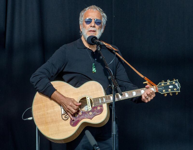 epa07469772 Yusuf Islam (Cat Stevens) performs as an estimated 20 thousand people attend the National Remembrance Service to those who were tragically killed in the Al Noor Mosque and the Linwood Islamic Centre shooting at Hagley Park, in Christchurch, New Zealand, 29 March 2019.  EPA-EFE/MARTIN HUNTER AUSTRALIA AND NEW ZEALAND OUT