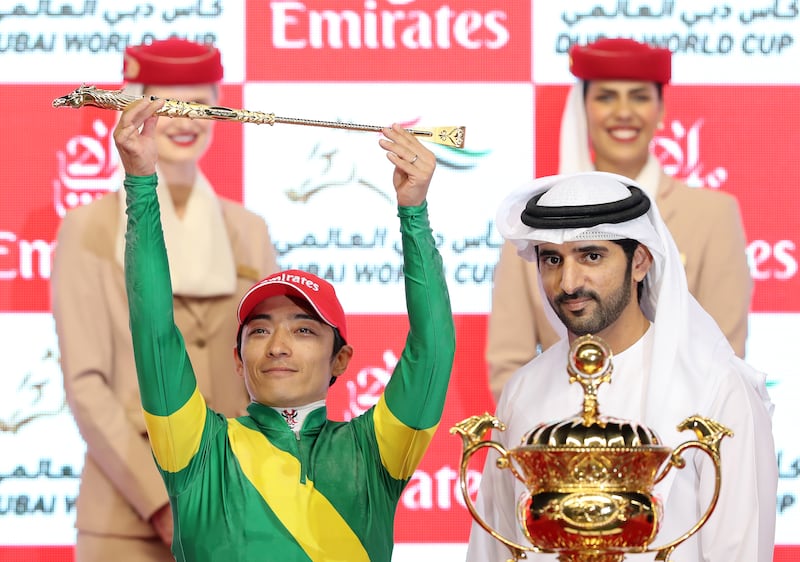 Jockey Yuga Kawada celebrates winning the Dubai World Cup on Ushba Tesoro after the trophy presentation by Sheikh Hamdan bin Mohammed, Crown Prince of Dubai, at Meydan Racecourse on March 25, 2023. Chris Whiteoak / The National