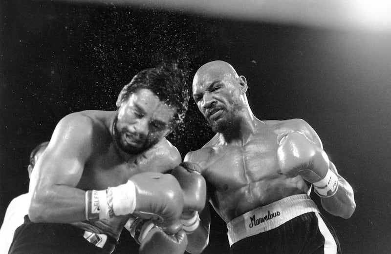 Marvin Hagler sends sweat flying as he pounds challenger Roberto Duran in the ninth round of a boxing bout in Las Vegas. Hagler scored a unanimous decision over Duran. Hagler, the middleweight boxing great whose title reign and career ended with a split-decision loss to “Sugar” Ray Leonard in 1987, died Saturday, March 13, 2021. He was 66. AP