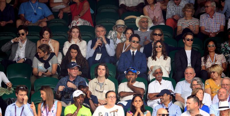 Tony McGill, Caitriona Balfe, Eleanor Tomlinson, Malcolm Tomlinson and Ruth Wilson, in Ralph Lauren, (row behind centre left to right) on day seven of the Wimbledon Championships at the All England Lawn Tennis and Croquet Club. PA