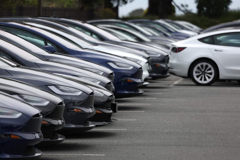 New Tesla cars are displayed on the sales lot at a dealership in Colma, California. AFP
