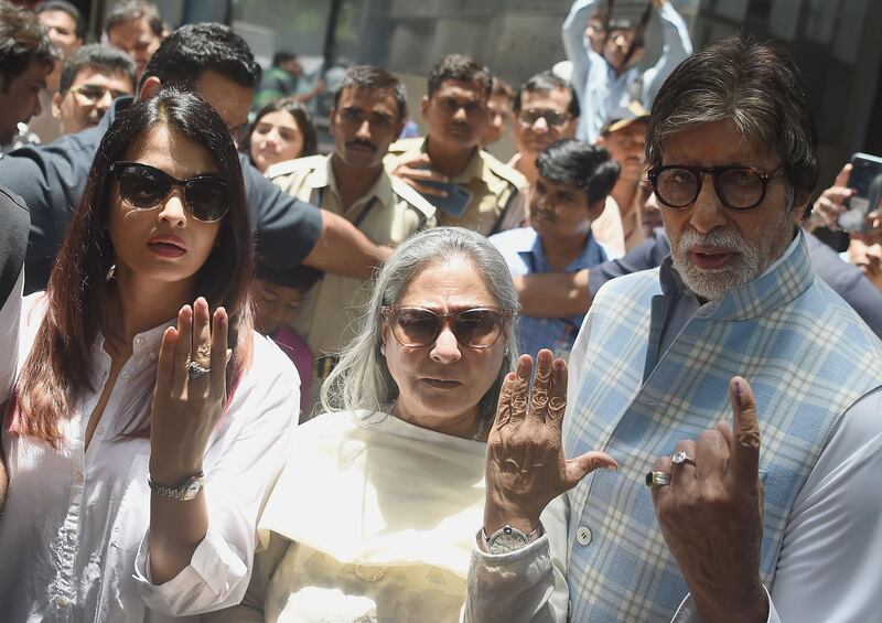 Bollywood actors Amitabh Bachchan (R), wife Jaya and daughter in law Aishwarya Rai Bachchan (L) pose for a picture after casting their vote at a polling station during the fourth phase of general election in Mumbai on April 29, 2019. Voting began for the fourth phase of India's general parliamentary elections as Indians exercise their franchise in the country's marathon election which started on April 11 and runs through to May 19 with the results to be declared on May 23. / AFP / PUNIT PARANJPE
