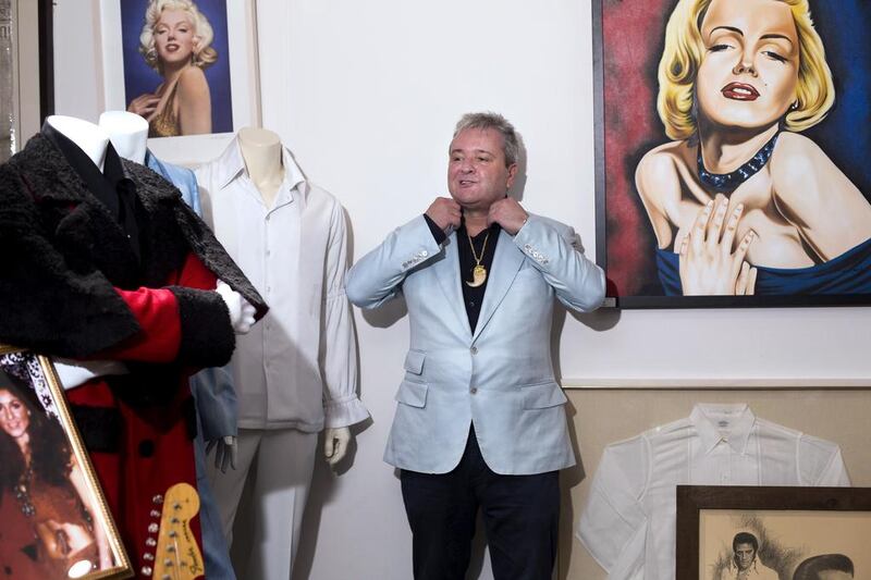 Tim Boswell stands among Elvis Presley and Marilyn Monroe memorabilia at his shop in Dubai. Clint McLean for The National