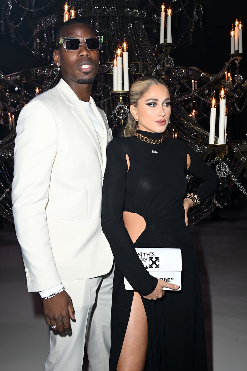Paul Pogba and Zulay Pogba at the Off-White womenswear autumn/winter 2022-2023 show.