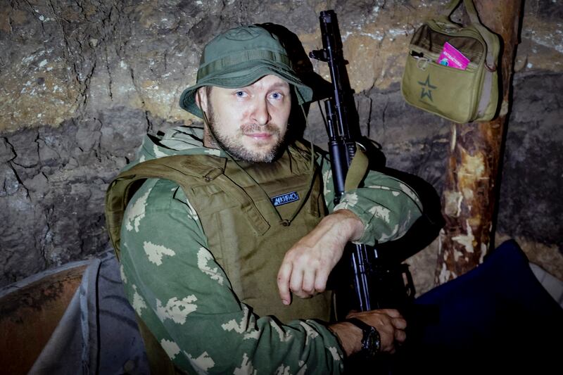 A member of the self-proclaimed Donetsk People's Republic (DPR) militia sits in a makeshift bunker near Avdiivka, in the Donbas region of Ukraine. EPA