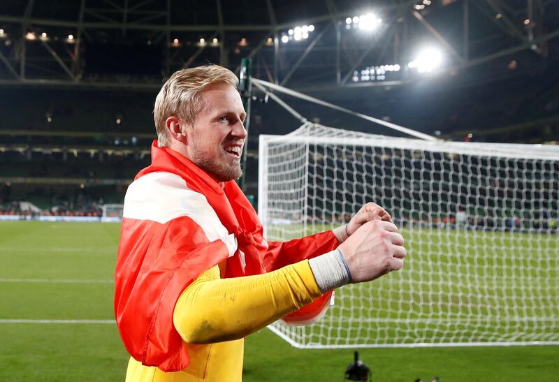 Denmark goalkeeper Kasper Schmeichel celebrates in front of their fans after the match. Reuters