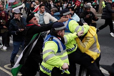 Scuffles broke out near Downing Street as protesters filed past the Cenotaph war memorial. AP 