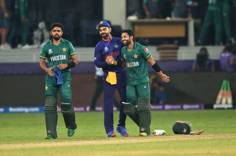 Indian cricket captain Virat Kohli congratulates Pakistan's Mohammad Rizwan at the end of the Cricket Twenty20 World Cup match between India and Pakistan in Dubai, UAE, on October 24. AP