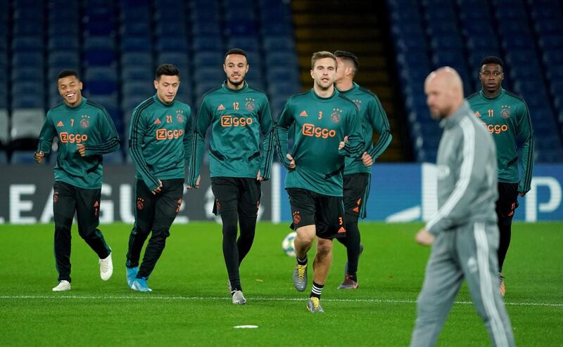 Ajax players jog during a training session at Stamford Bridge. PA