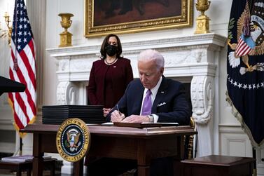 President Joe Biden signs an executive order after speaking during an event on his administration's Covid-19 response.  Bloomberg