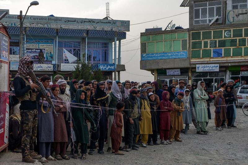Afghan people queue up to donate blood to earthquake victims. AFP
