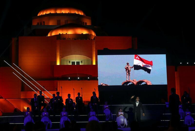 A boy sings military songs during the first concert of the Cairo Symphonic Orchestra after the Cairo Opera House reopened, amid concerns about the spread of coronavirus, in Cairo, Egypt. Reuters