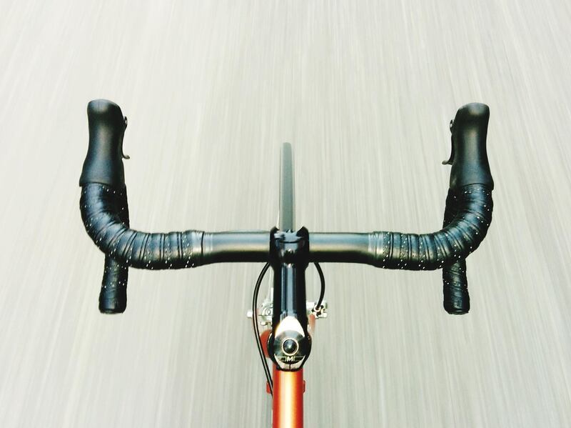 Cropped Image Of Bicycle On Road. Getty Images