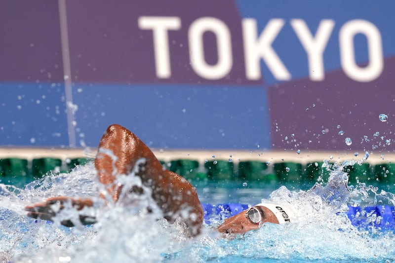 Ahmed Hafnaoui, of Tunisia, swims in the final.