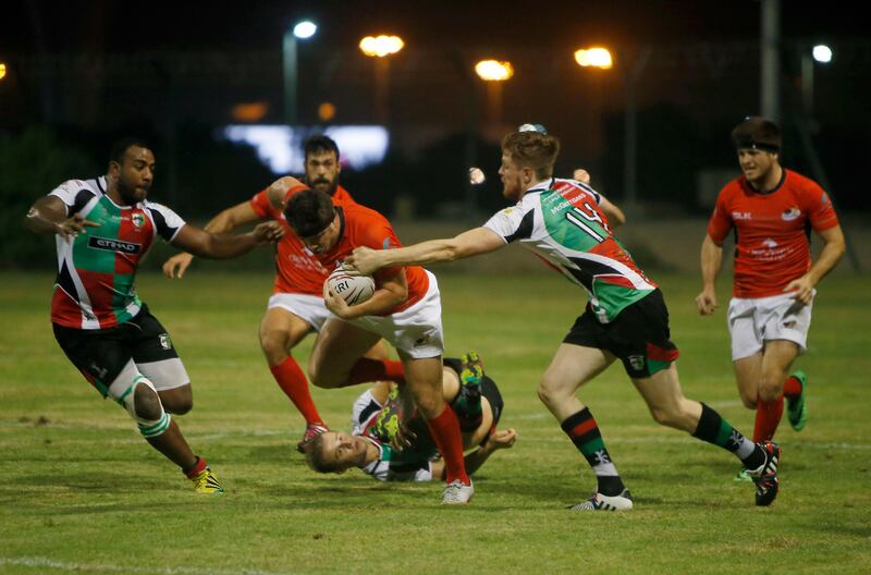 ABU DHABI - UNITED ARAB EMIRATES - 06OCT2016 - Abu Dhabi Saracens (in red) and Abu Dhabi Harlequins tussels for the ball in the West Asia Premiership rugby match yesterday at Al Ghazal Golf Club Rugby field in Abu Dhabi. Ravindranath K / The National (to go with Paul Radley story for Sports) ID: 77565 *** Local Caption ***  RK0610-Rugby06.jpg