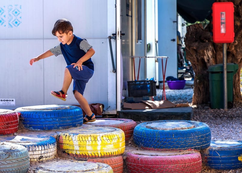 Mytilene, Greece, September 12, 2018.  The Kara Tepe refugee camp.  A boy enjoys the tyre playground area of the camp.
Victor Besa/The National
Section:  WO
Reporter:  Anna Zacharias